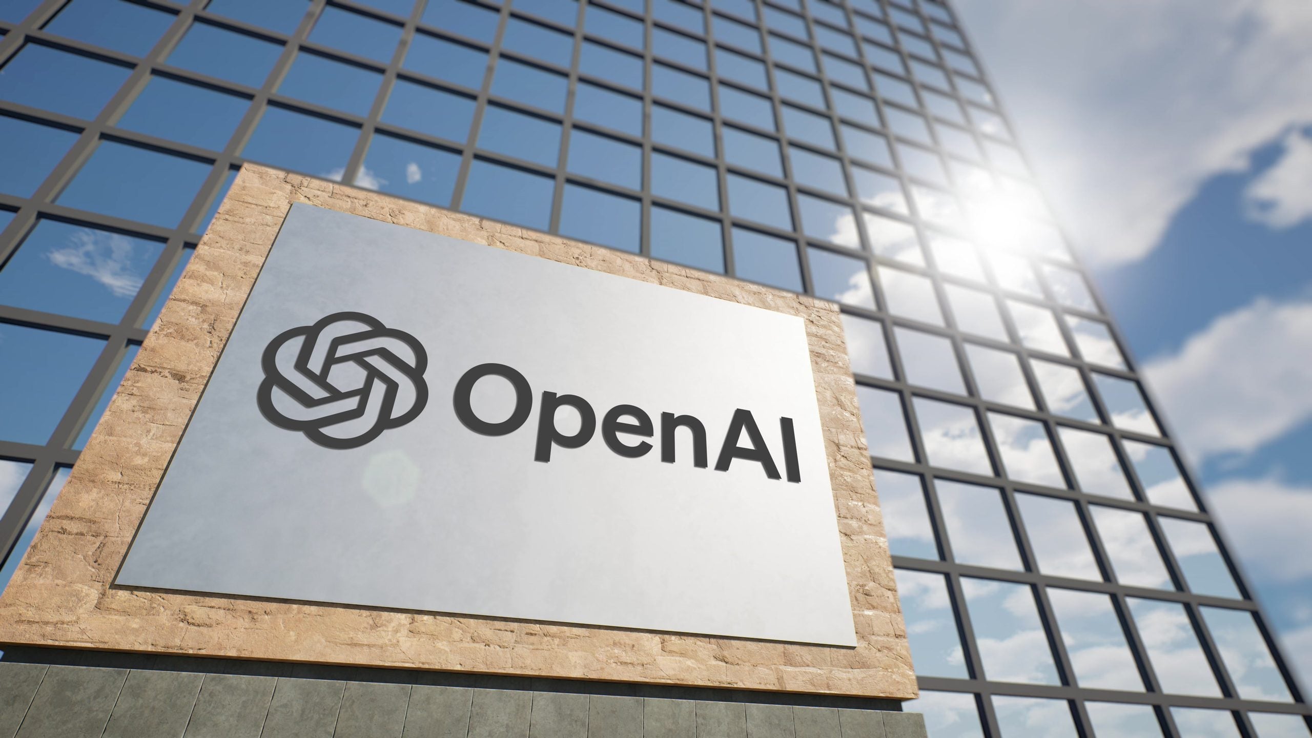 Logotipo de OpenAI frente al edificio corporativo